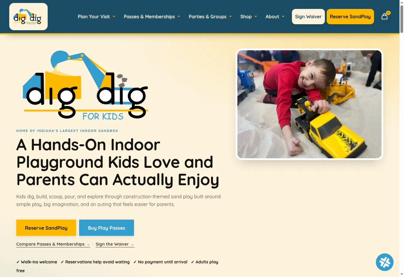 Dig Dig for Kids homepage with indoor playground messaging, visit navigation, play-pass links and a child playing in sand.