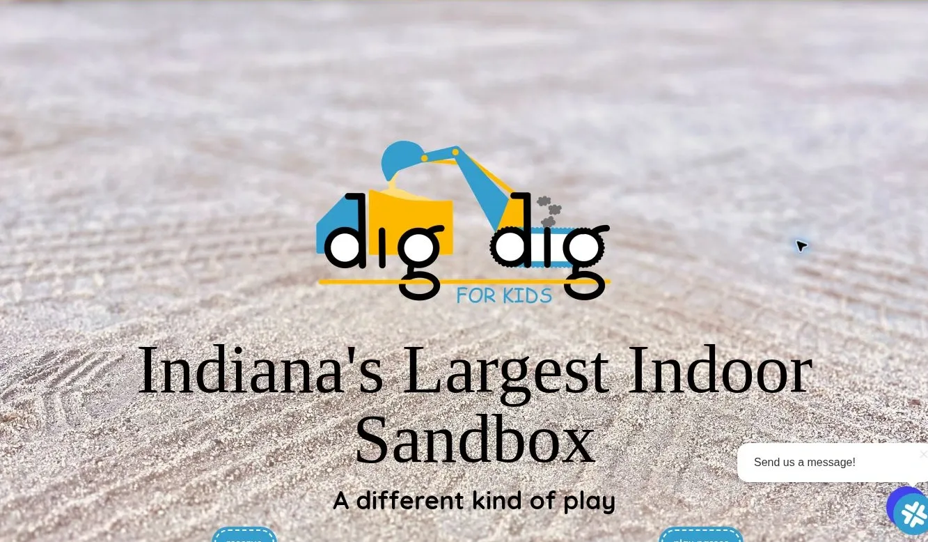 Earlier Dig Dig homepage body with a sand background, centered logo, headline and small visit actions.
