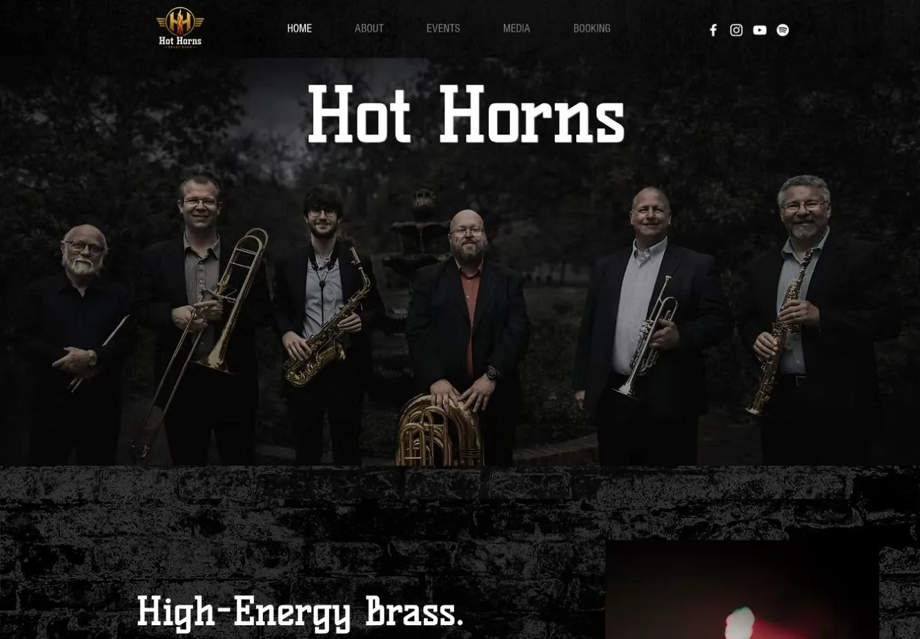 Current Hot Horns website with prominent band identity, ensemble photograph and booking navigation.
